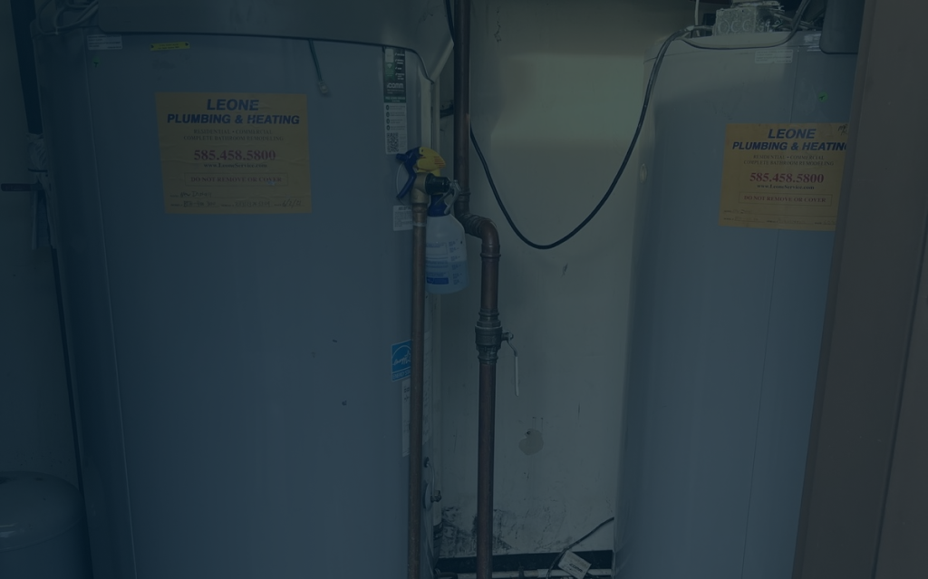 Technician performing heating services in Lockport, New York on furnace unit