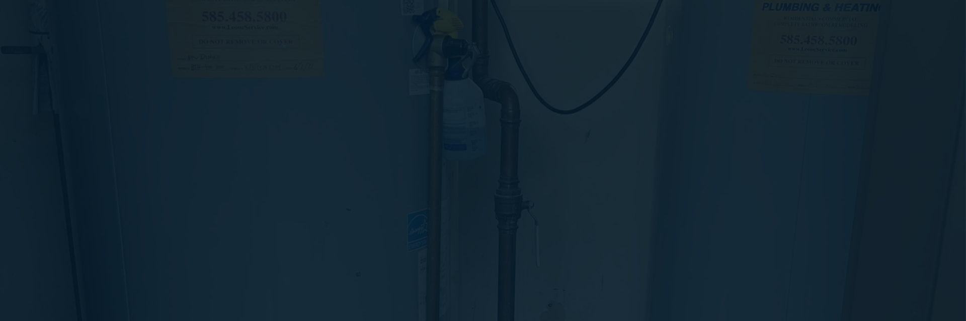 Technician performing heating services in Lockport, New York on furnace unit
